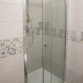 Large bathroom with shower cubicle